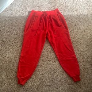 Red sweatpants, small in men’s, medium in women’s